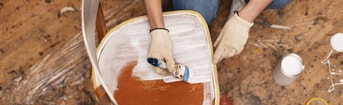 Top view woman restoring wooden furniture